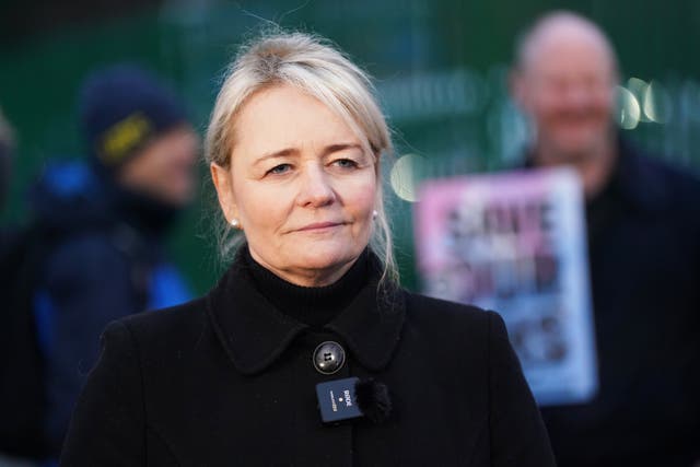 Sharon Graham standing in front of a picket line