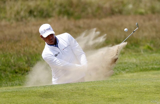 Stewart Cink plays out of a bunker