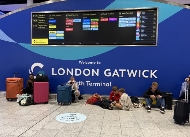 Passengers at Gatwick Airport’s South Terminal in Crawley, West Sussex, after flights were cancelled on Tuesday because of a UK air traffic control issue