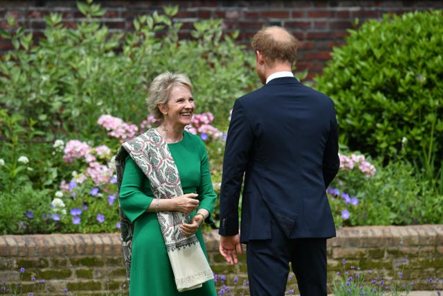 The Duke of Sussex greets Julia Samuel, founder of Child Bereavement UK, ahead of the unveiling of a statue of his mother Diana in 2021