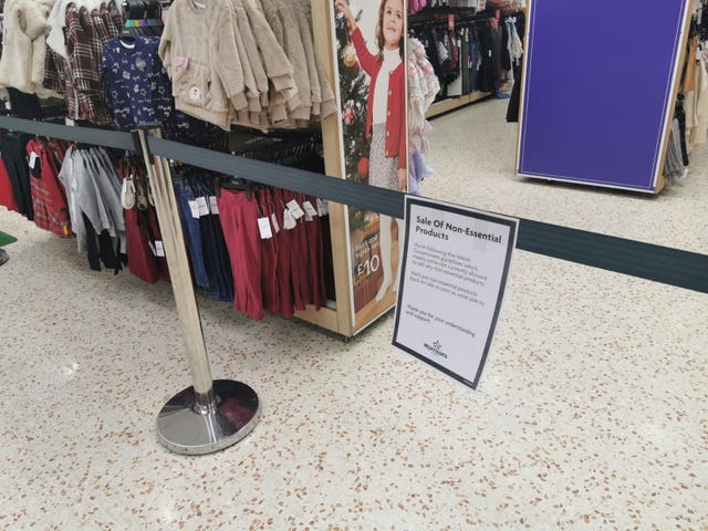 A notice informing customers of the sales of non-essential products in a Morrison’s store in Cardiff Bay, Wales