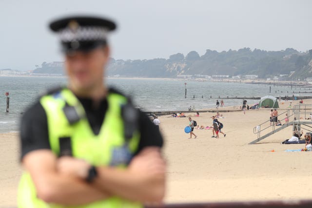 The police on patrol near Bournemouth Pier following three stabbings (Andrew Matthews/PA)