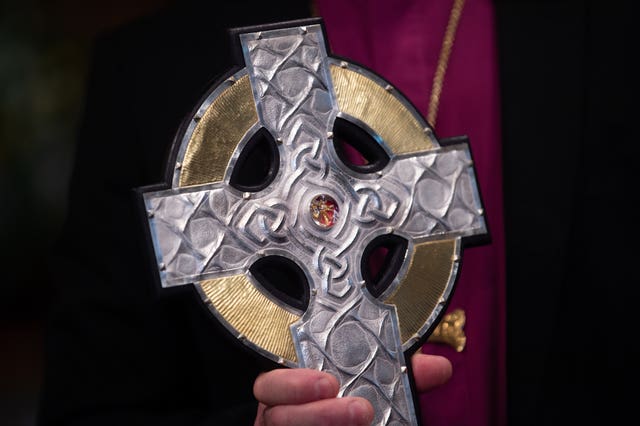 The Cross of Wales is seen during a blessing service at Holy Trinity Church in Llandudno 