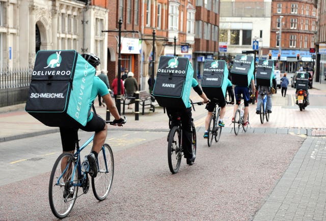 Deliveroo drivers, a common sight across the UK.