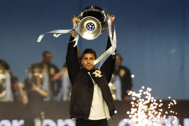 Rodri celebrates at Manchester City's parade