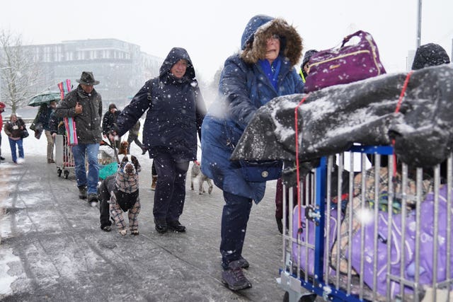 People arrive for the first day of the Crufts Dog Show