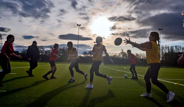Children play rugby on the new 3G pitch at Victoria Park Rugby League Football Club, Warrington