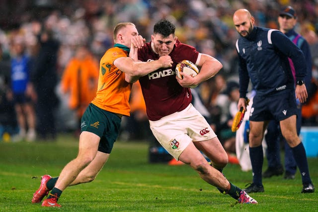 British and Irish Lions hooker Dan Sheehan is tackled by Australia's Max Jorgensen during the third Test in Syndey