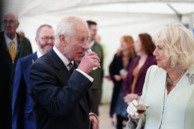 Charles and Camilla try a glass of Duncan Taylor whisky as they attend a celebration at Edinburgh Castle to mark the 900th anniversary of the City of Edinburgh