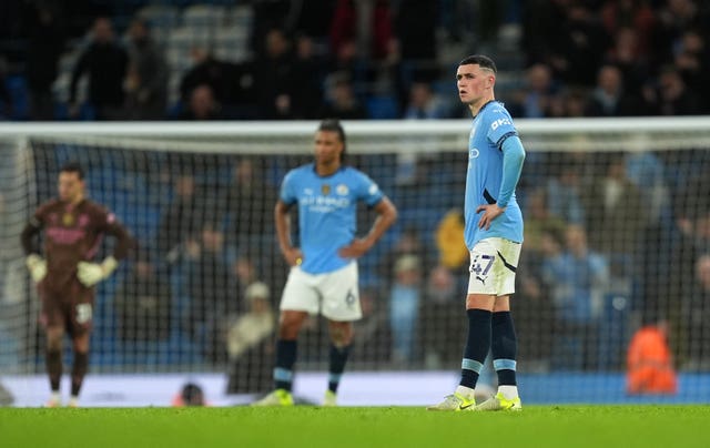 Manchester City’s Phil Foden appears dejected after Tottenham score their fourth goal during their 4-0 win at the Etihad Stadium