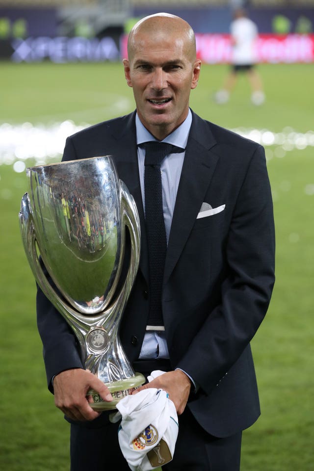 Zinedine Zidane collecting his fifth trophy as Real Madrid boss after winning the UEFA Super Cup against Manchester United