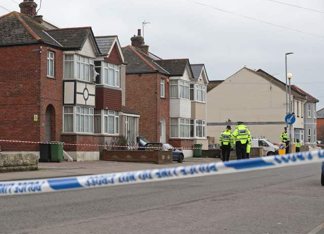Police at the scene where two women were shot dead (Gareth Fuller/PA)