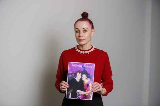 Martina Ferguson holds an image of her late mother Ursula Derry