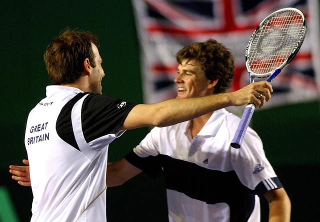 Rusedski, left, and Jamie Murray celebrate after beating Holland's Robin Haase and Rogier Wassen at Birmingham's NEC Arena