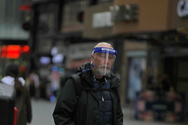A man wearing a face shield