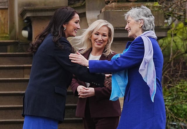 Deputy First Minister Emma Little Pengelly and First Minister Michelle O’Neill greet Catherine Connolly