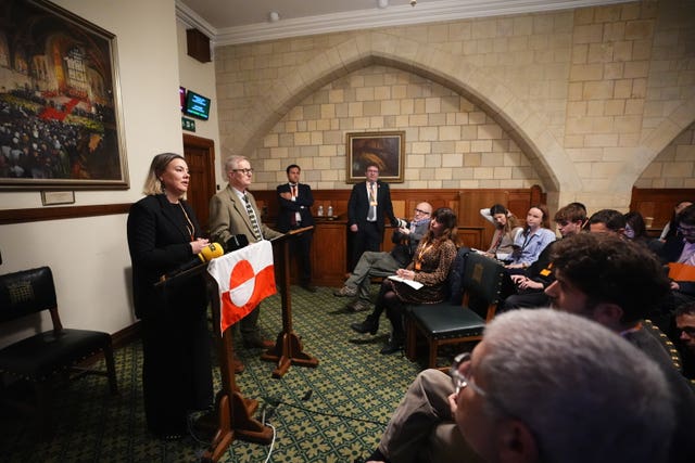 Naaja Nathanielsen answers questions from reporters in Parliament