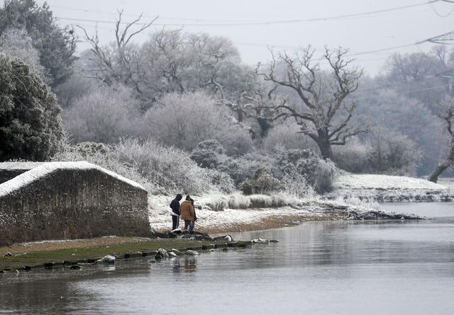 Walkers in the snow and frost in Marchwood near Southampton
