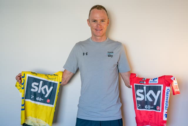Chris Froome added La Vuelta's red jersey to claim a rare Grand Tour double