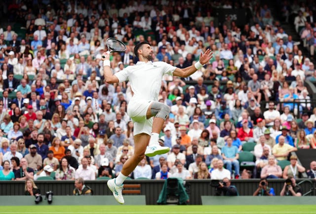 Novak Djokovic leaps to hit a shot
