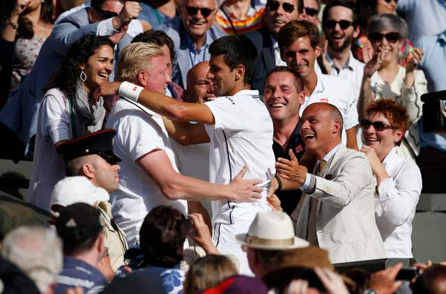 Novak Djokovic embraces then coach Boris Becker after winning Wimbledon in 2014