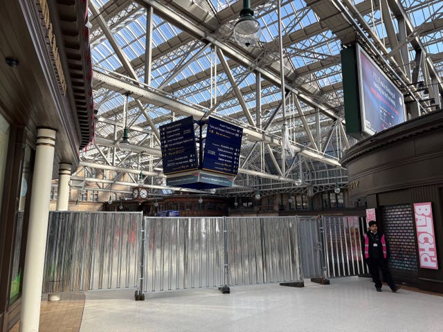 Metal fencing blocking off part of Glasgow Central station