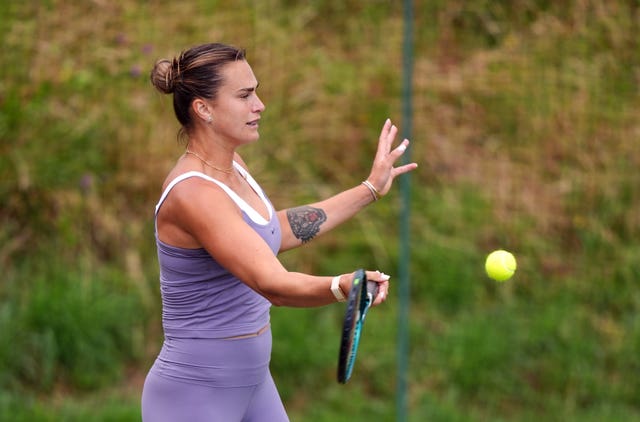 Aryna Sabalenka hits a forehand on the practice courts at Wimbledon