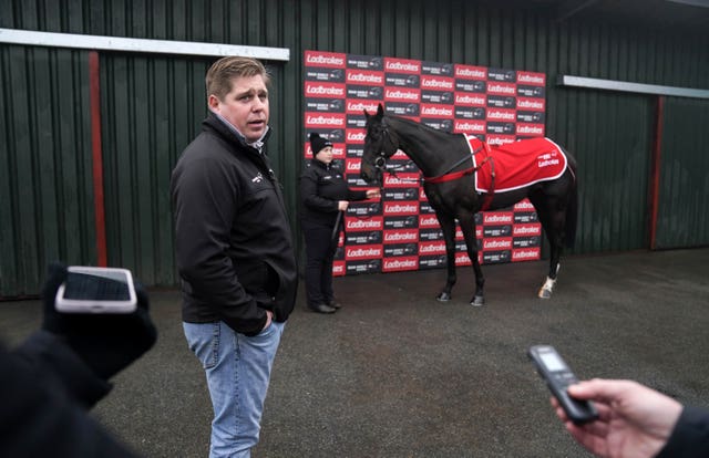 Dan Skelton talks to media alongside Third Time Lucki, during a visit to Dan Skelton’s stables at Lodge Hill, Alcester