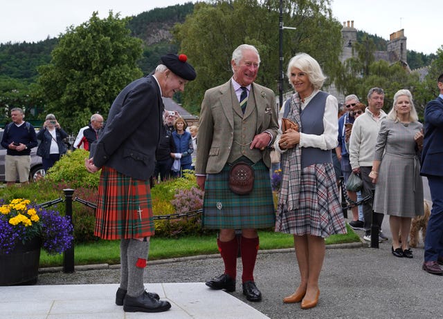 Prince of Wales and the Duchess of Cornwall chat with Hugh Inkster 