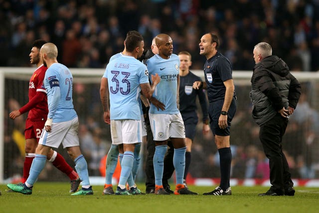 Manchester City’s Fernandinho and Gabriel Jesus remonstrate with Referee Antonio Miguel Mateu Lahoz at half-time.