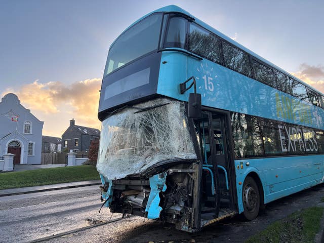 A wrecked blue airport bus in Belfast