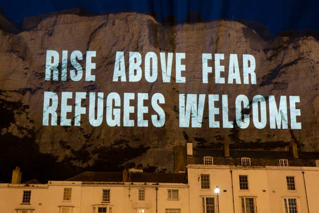 White Cliffs lit up with ‘refugees welcome’ ahead of protests over crossings