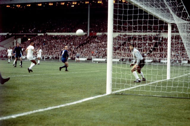 European Cup glory followed the next year. Here, Charlton (centre) scores the first goal of his brace in the 4-1 final win over Benfica at Wembley