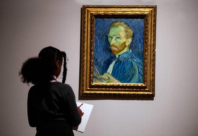 A visitor makes a sketch of Self-Portrait by Vincent Van Gogh