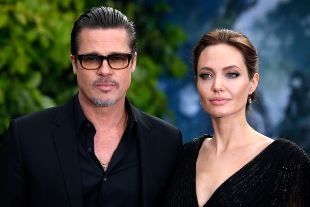 Brad Pitt and Angelina Jolie attending a premiere in London in 2014