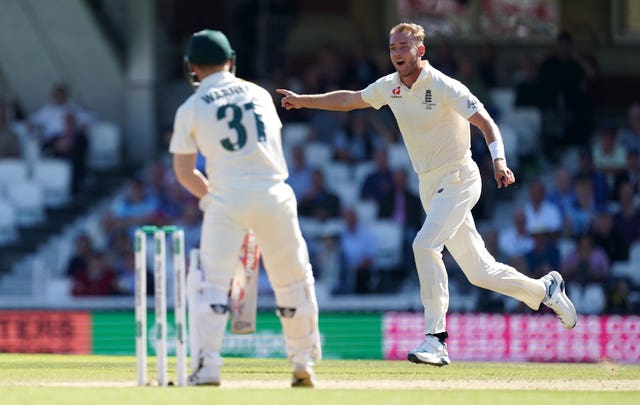Stuart Broad celebrates taking the wicket of David Warner 
