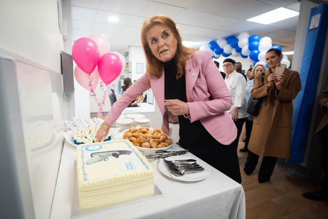 The duchess cuts a cake as she opens the refurbished unit 