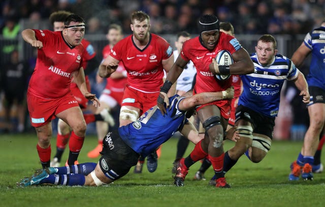 Maro Itoje, right, takes on the tackle of Bath's Elliott Stooke