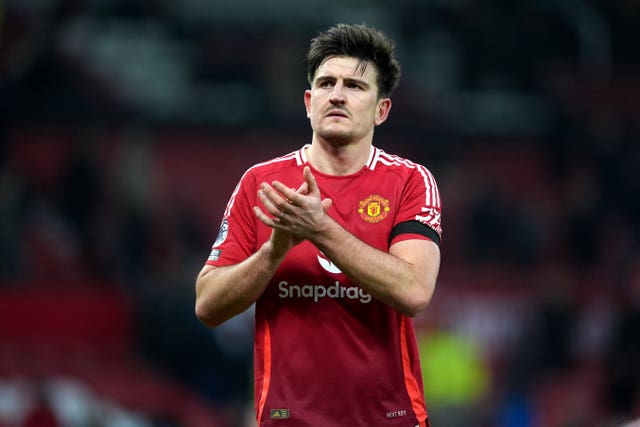 Harry Maguire applauds the Manchester United fans
