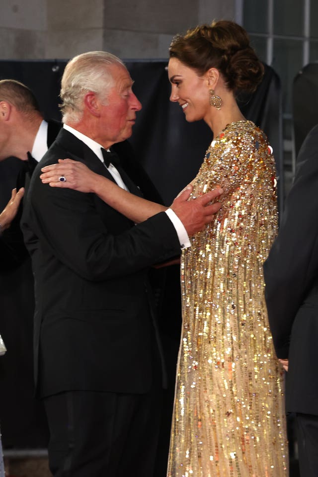 Charles and Kate greet each other affectionately at the James Bond movie premiere in 2021