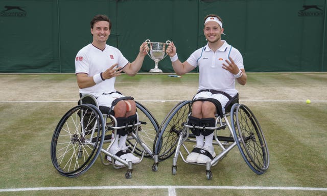 Alfie Hewett and Gordon Reid hold aloft the Wimbledon doubles' trophy