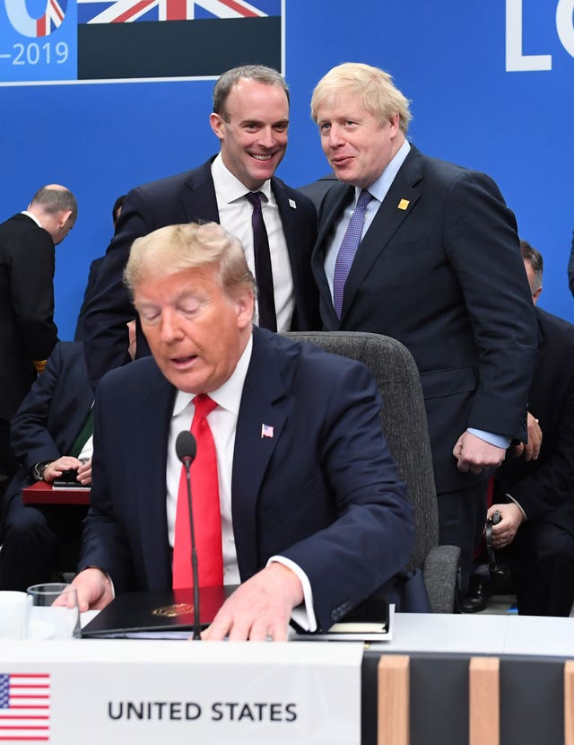 US President Donald Trump (front) with Foreign Secretary Dominic Raab (centre left) and Prime Minister Boris Johnson (Stefan Rousseau/PA)