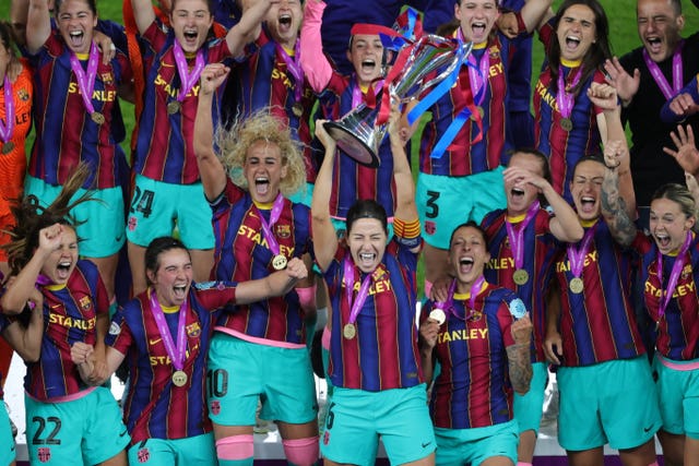 Barcelona celebrate after winning the Women's Champions League in 2021 (Adam Ihse/PA)