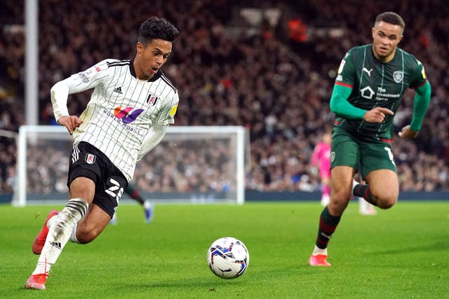 Fulham’s Fabio Carvalho runs past Barnsley’s Carlton Morris