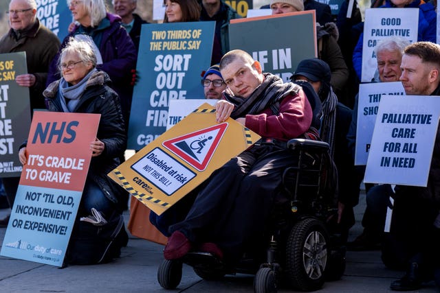 Protesters take part in a rally organised by Care Not Killing to oppose the Assisted Dying Bill outside the Scottish Parliament in Edinburgh