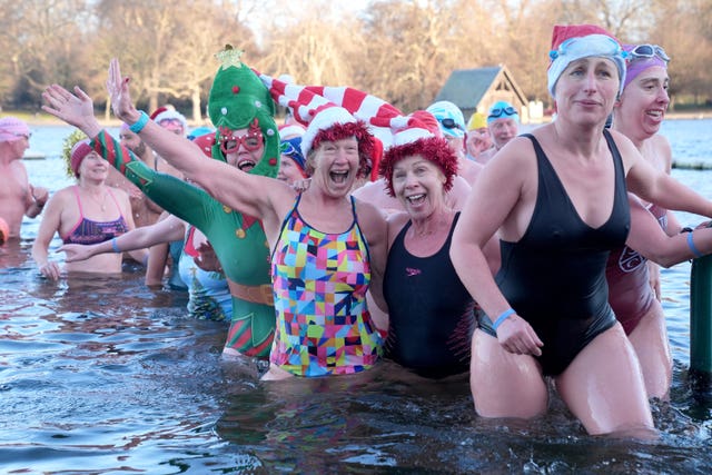 Swimmers emerging from the water after taking part in the Peter Pan Cup race
