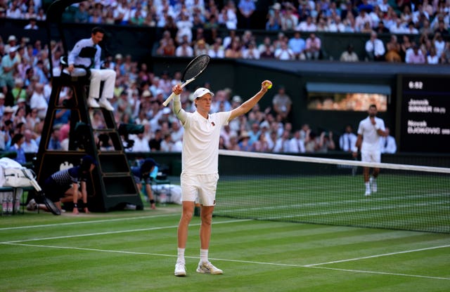 Jannik Sinner celebrates victory over Novak Djokovic
