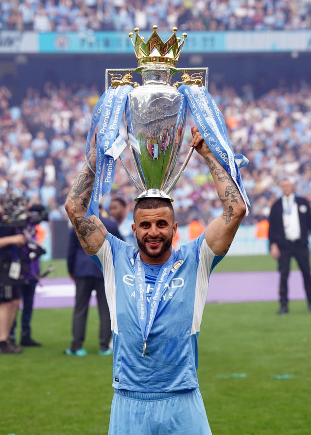 Kyle Walker lifts the Premier League trophy