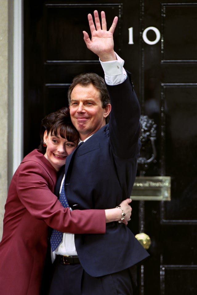 Sir Tony and Cherie Blair embrace in front of No 10 Downing Street after the Labour Leader was elected Prime Minister