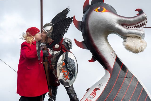 Lynden Nicolson, the Guizer Jarl of the Jarl Squad, kisses his wife